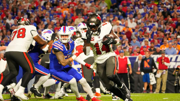 Tampa Bay Buccaneers wide receiver Chris Godwin (14) runs with the ball against the Buffalo Bills during the first half at Highmark Stadium.